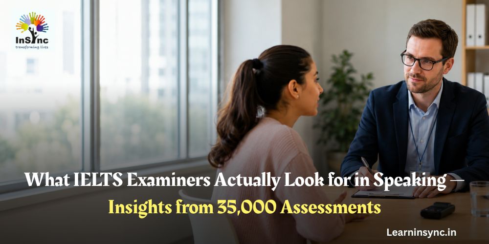 Professional IELTS speaking test interview in a modern office, with an examiner taking notes while a candidate speaks across a desk in a bright, realistic assessment setting.